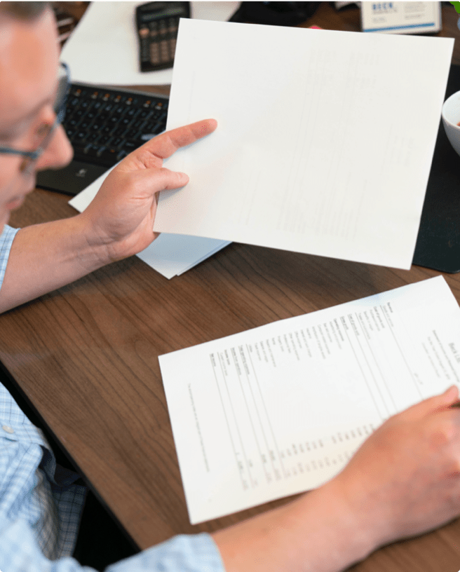 Kelly Beck, accountant, reviewing reports for clients